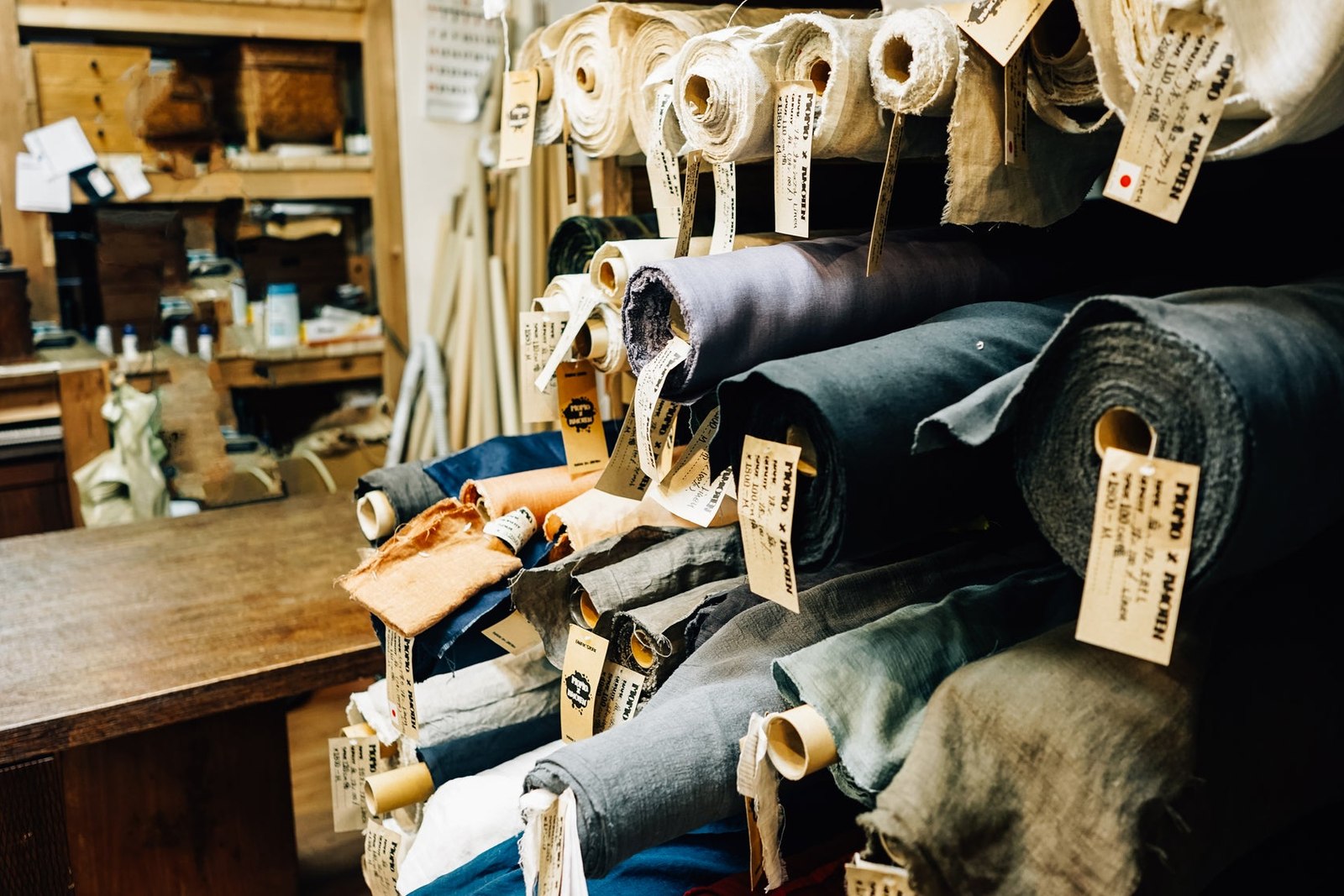 Multiple Rolls Of Fabric On Shelves