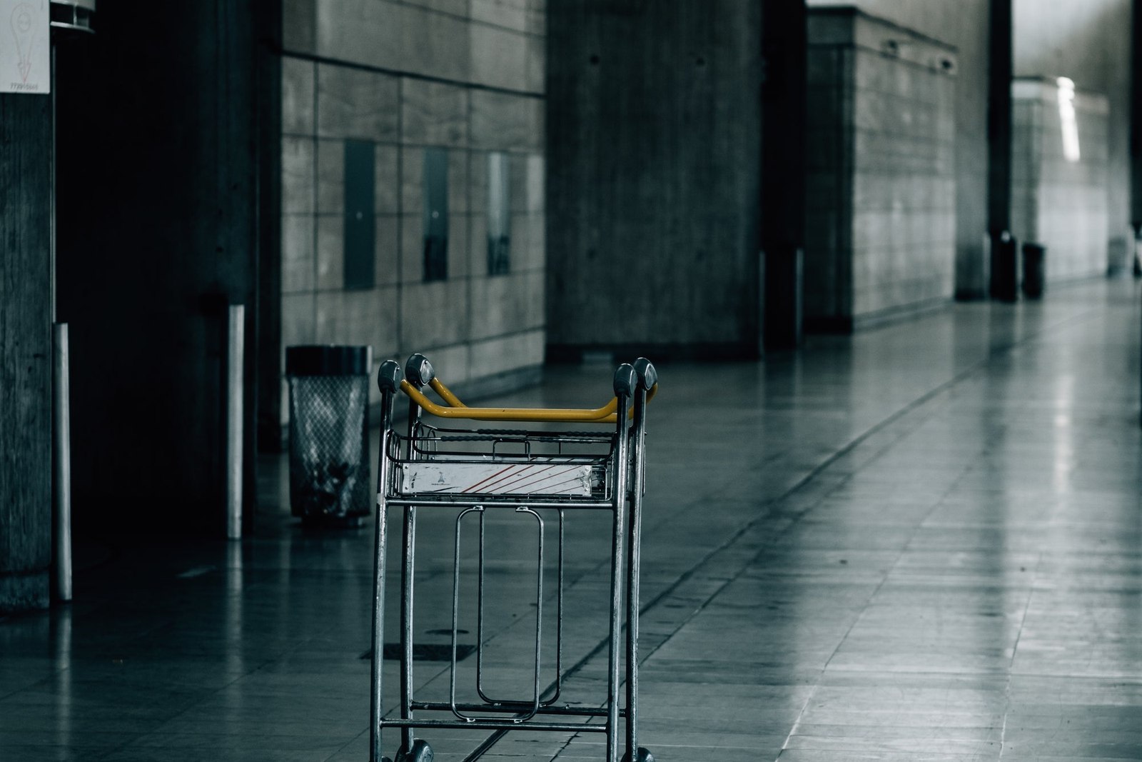Empty Luggage Cart In An Industrial Hallway