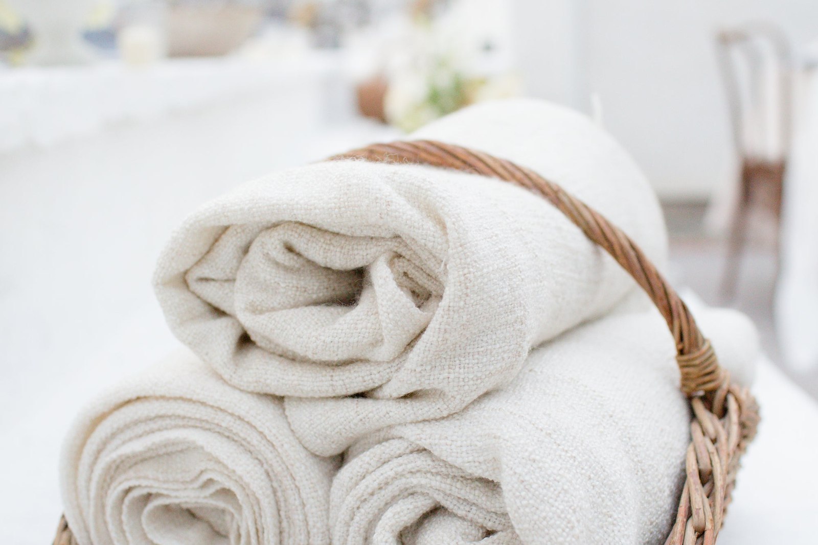 Rolled Fabric In A Wicker Basket